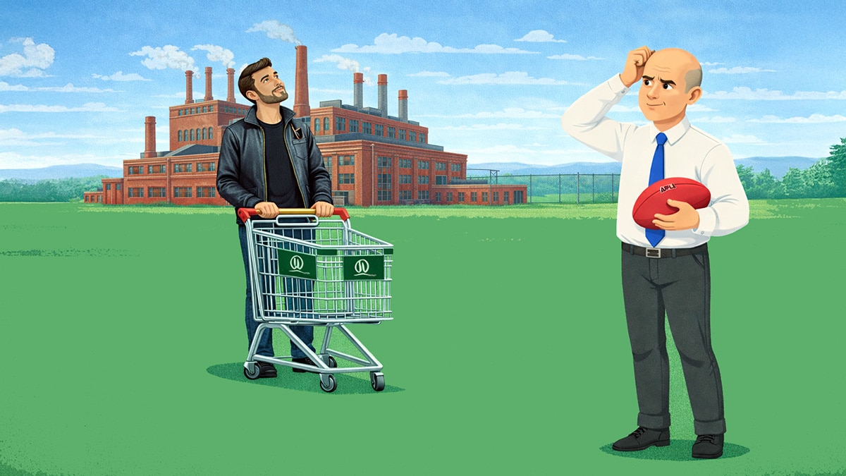 Man with shopping trolley looking toward a bald businessman holding an AFL ball, standing in front of a redbrick factory on open grassland