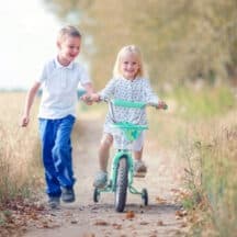 Brother and sister on dirt path