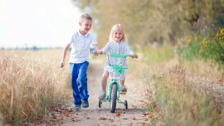 Brother and sister on dirt path
