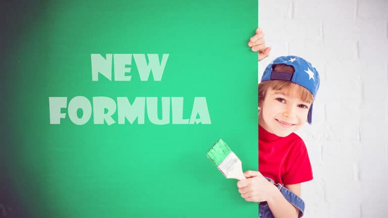 Child painting new formula on green wall