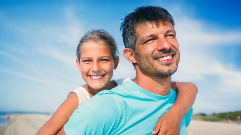 Father and daughter at the beach