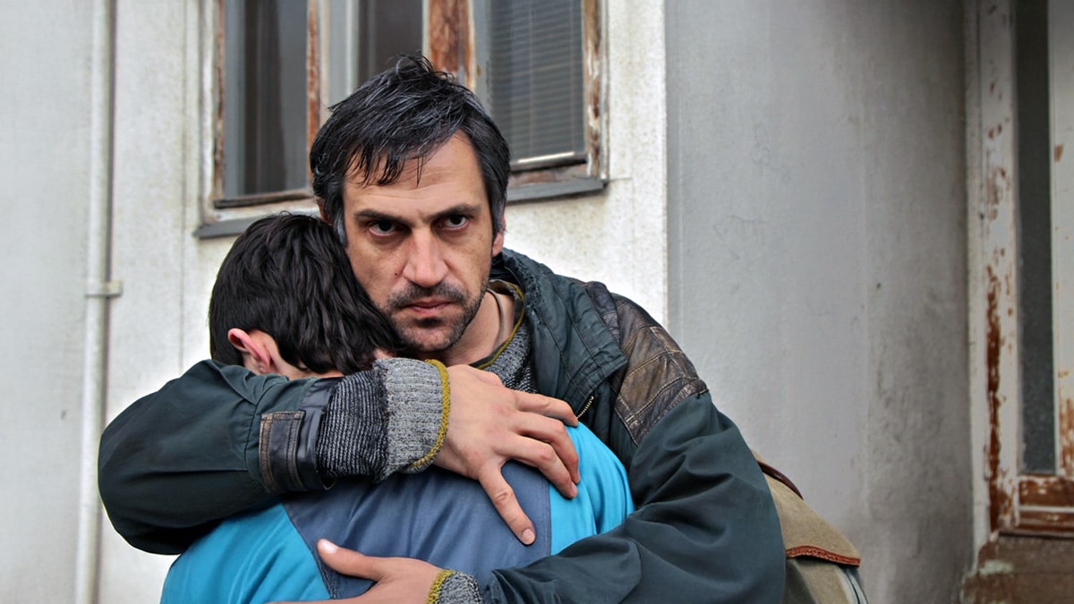 Father clutching son