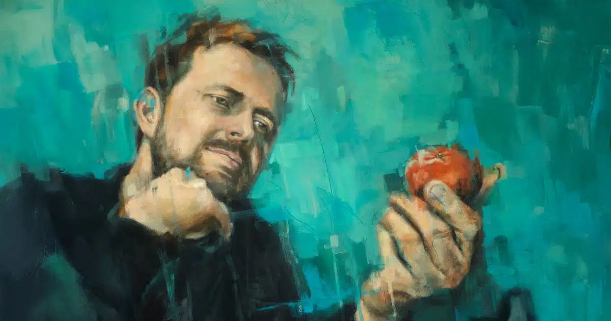Father contemplating an apple