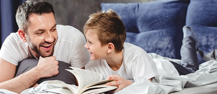 Father and son reading together.