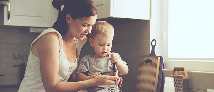 Mother cooking with child.