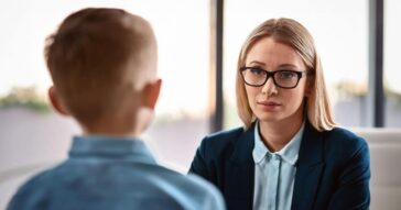 Psychologist or counsellor with boy