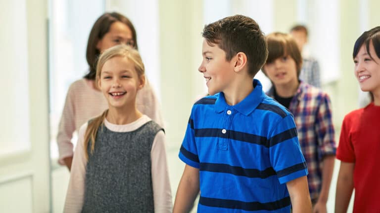 Smiling children walking