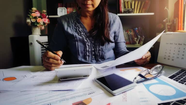 Woman doing income tax calculations
